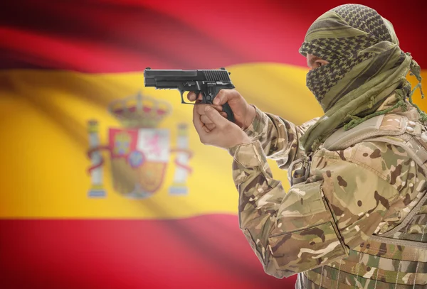 Male in muslim keffiyeh with gun in hand and national flag on background - Spain — Fotografia de Stock