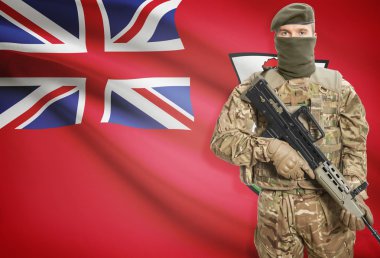 Soldier holding machine gun with flag on background series - Bermuda