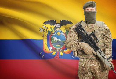 Soldier holding machine gun with flag on background series - Ecuador