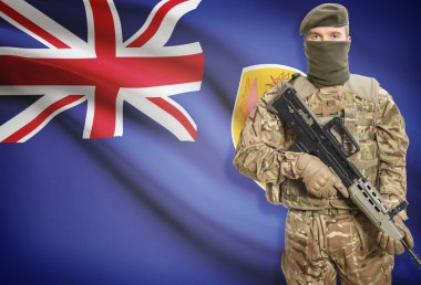 Soldier holding machine gun with flag on background series - Turks and Caicos Islands
