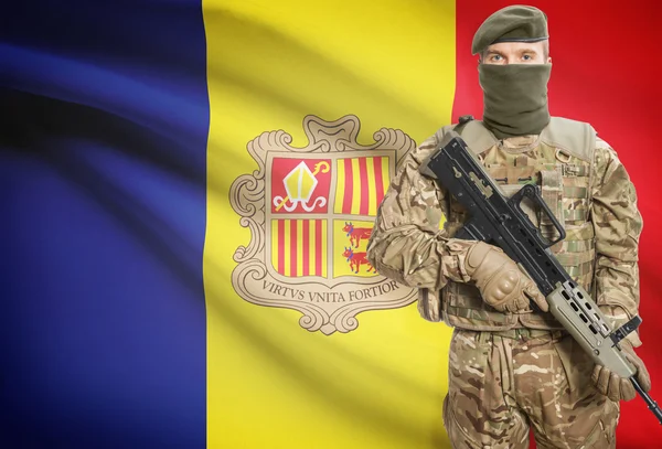 Soldier holding machine gun with flag on background series - Andorra — Stockfoto