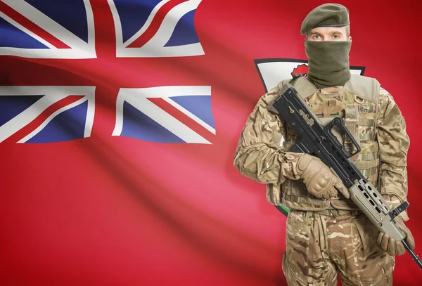 Soldier holding machine gun with flag on background series - Bermuda — Stock Photo, Image