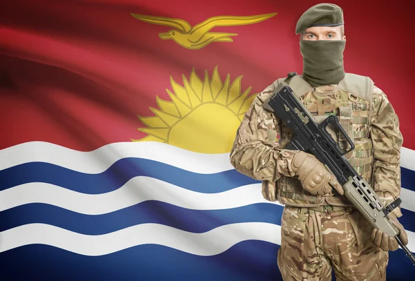 Soldier holding machine gun with flag on background series - Kiribati — Stock Fotó
