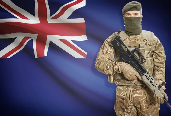 Soldier holding machine gun with flag on background series - New Zealand — Stok Foto