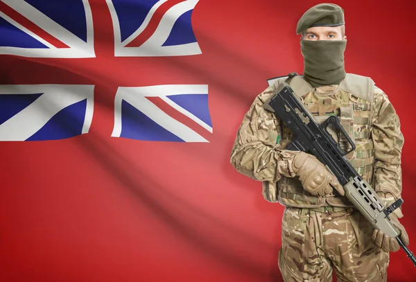 Soldier holding machine gun with Canadian province flag on background series - Manitoba — Stock Photo, Image