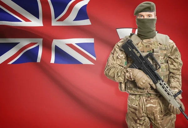 Soldier holding machine gun with Canadian province flag on background series - Ontario — Stock Photo, Image