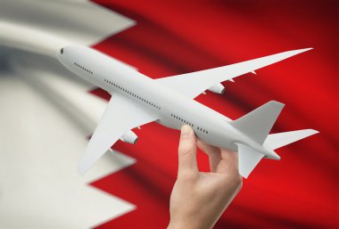 Uçağın içinde el ile arka plan - Bahreyn bayrağı