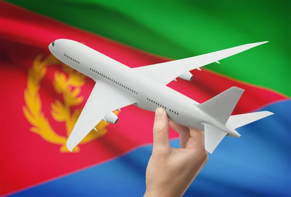 Αεροπλάνο στο χέρι με σημαία σε φόντο - Ερυθραία — Φωτογραφία Αρχείου