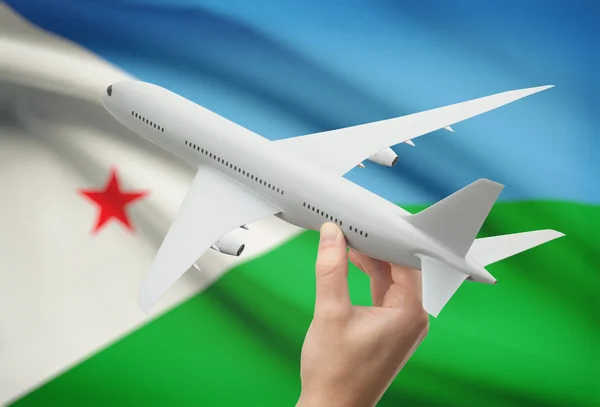 Uçağın içinde el ile arka plan - Cibuti bayrağı — Stok fotoğraf
