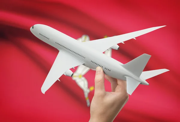 Airplane in hand with flag on background - Isle of Man — Stock Photo, Image