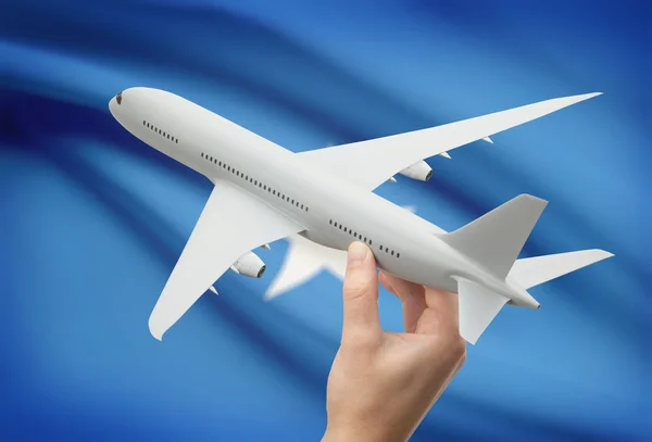Самолет в руку с флагом на фоне - Сомали — стоковое фото