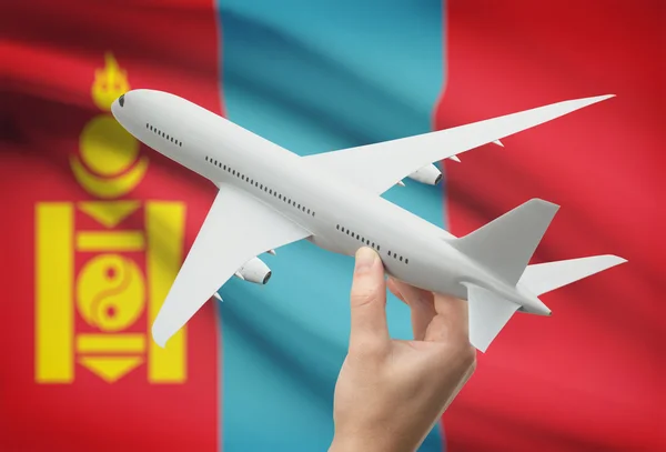 Αεροπλάνο στο χέρι με σημαία σε φόντο - Μογγολία — Φωτογραφία Αρχείου