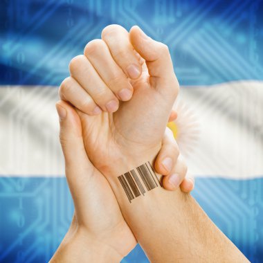 Barcode ID number on wrist and national flag on background series - Argentina
