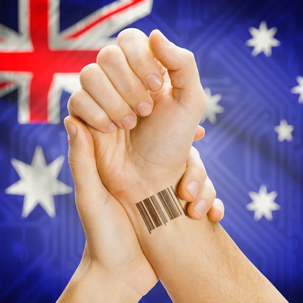 Barcode ID number on wrist and national flag on background series - Australia — Stock Fotó