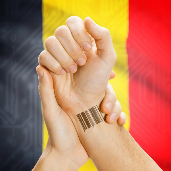 Barcode ID number on wrist and national flag on background series - Belgium — Stock Photo, Image