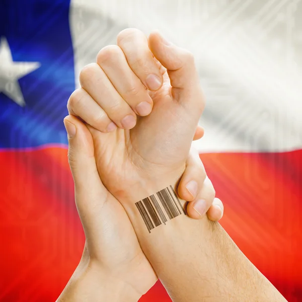 Barcode ID number on wrist and national flag on background series - Chile — Zdjęcie stockowe