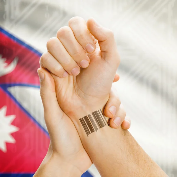 Barcode ID number on wrist and national flag on background series - Nepal — Fotografia de Stock