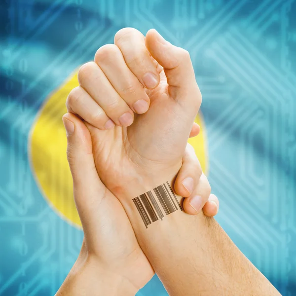 Barcode ID number on wrist and national flag on background series - Palau — 图库照片