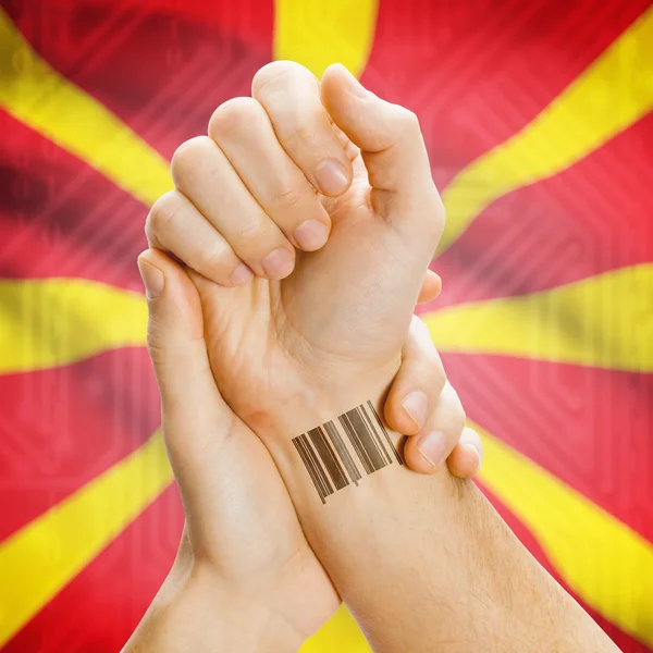 Barcode ID number on wrist and national flag on background series - Macedonia — 图库照片