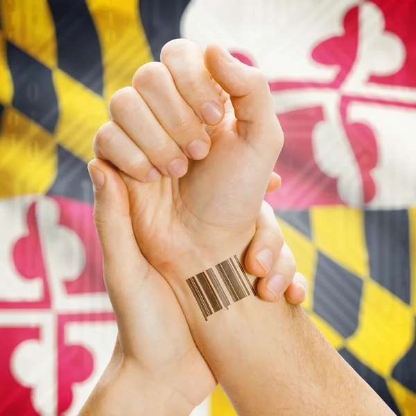 Barcode ID number on wrist and USA states flags on background series - Maryland — Stockfoto