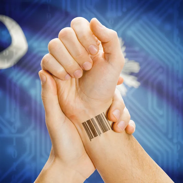 Barcode ID number on wrist and USA states flags on background series - South Carolina — 图库照片