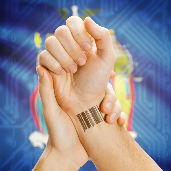 Barcode ID number on wrist and USA states flags on background series - New York —  Fotos de Stock