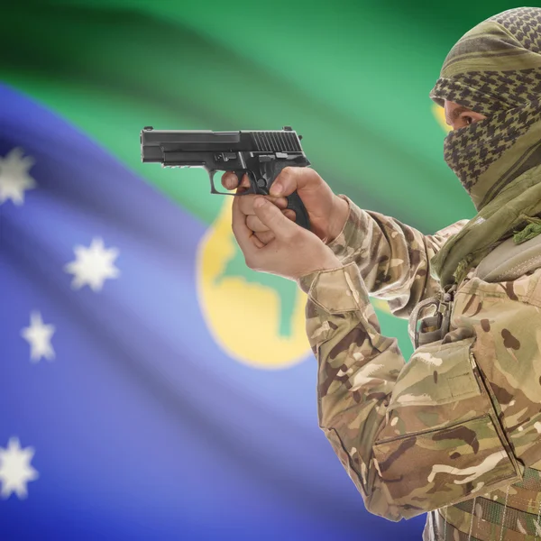 Чоловіки з пістолетом у руках і Національний прапор на фоні - Острів Різдва — стокове фото