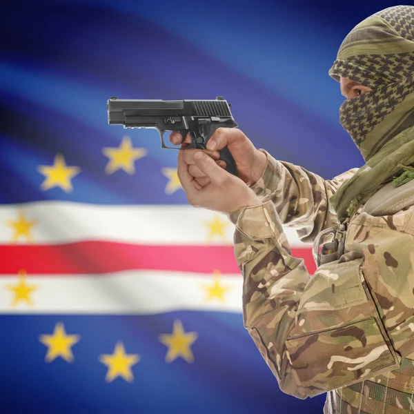 Male with gun in hands and national flag on background - Cape Verde — Stok Foto