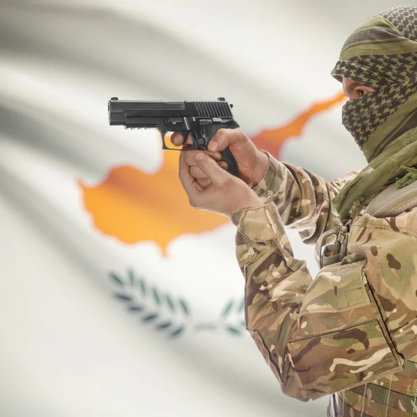 Male with gun in hands and national flag on background - Cyprus — Stok Foto