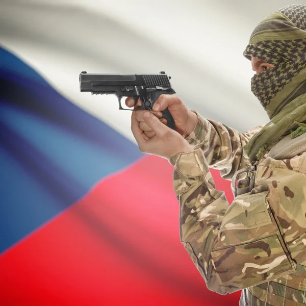 Male with gun in hands and national flag on background - Czech Republic — Stock Photo, Image