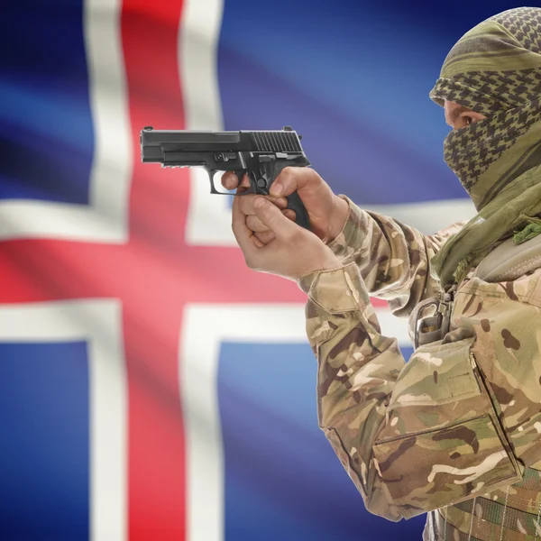 Male with gun in hands and national flag on background - Iceland — Stok Foto