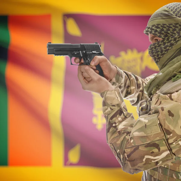 Male with gun in hands and national flag on background - Sri Lanka — Stock Photo, Image