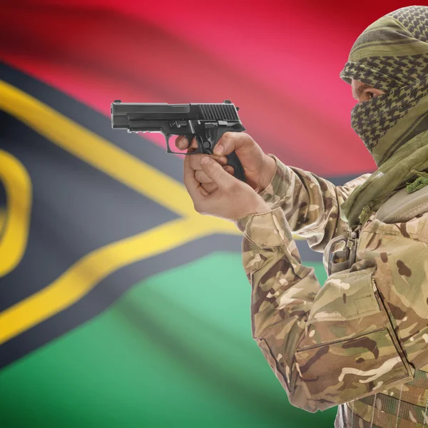 男带枪在手和国旗上的背景-瓦努阿图 — 图库照片