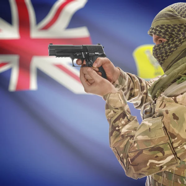 Male with gun in hands and national flag on background - Saint Helena — стокове фото