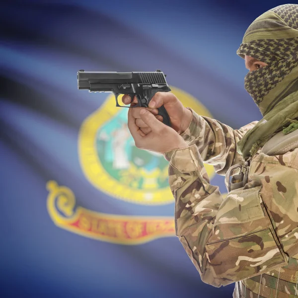 Male with gun in hands and USA state flag on background series - Idaho — Φωτογραφία Αρχείου