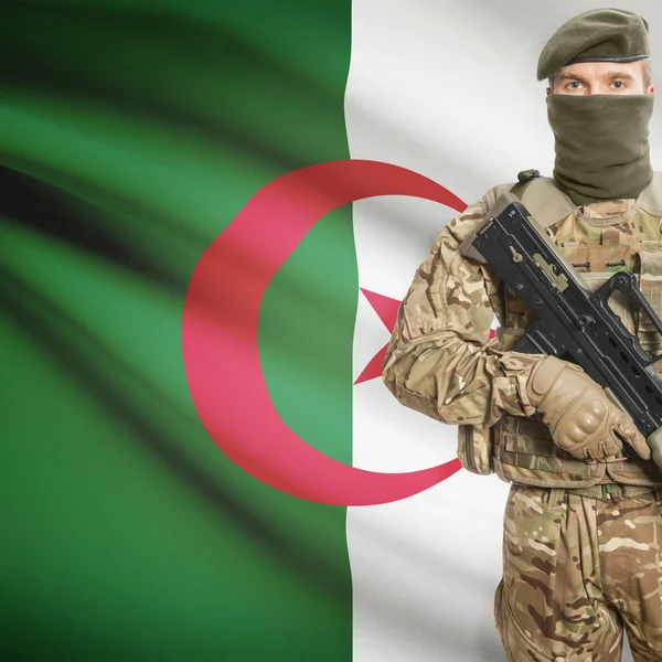 Soldier with machine gun and flag on background - Algeria — Stok Foto