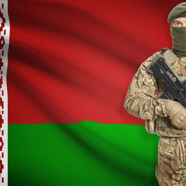 Soldier with machine gun and flag on background - Belarus — Stok Foto