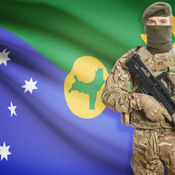 Soldier with machine gun and flag on background - Christmas Island — Stok Foto