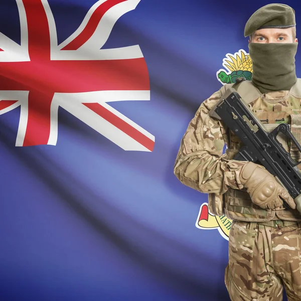 Soldier with machine gun and flag on background - Cayman Islands — Stok Foto