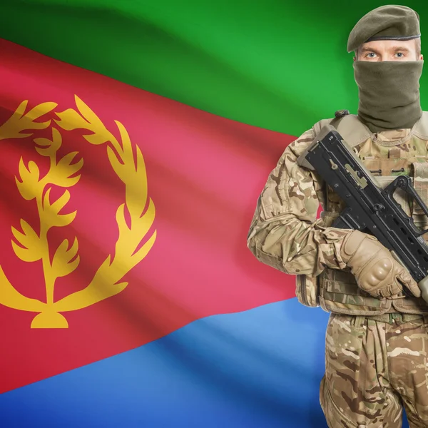 Soldier with machine gun and flag on background - Eritrea — Stok Foto