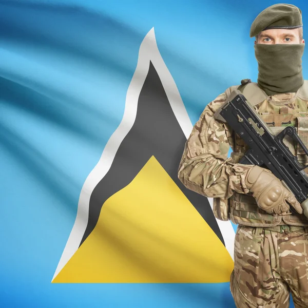 Soldier with machine gun and flag on background - Saint Lucia — Stok Foto