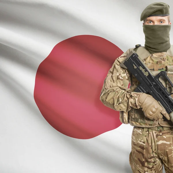 Soldier with machine gun and flag on background - Japan — Stok Foto