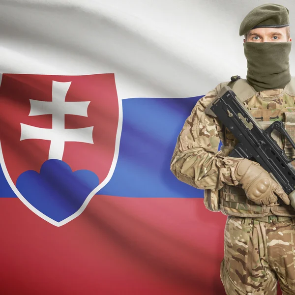 Soldier with machine gun and flag on background - Slovakia — Stock Photo, Image