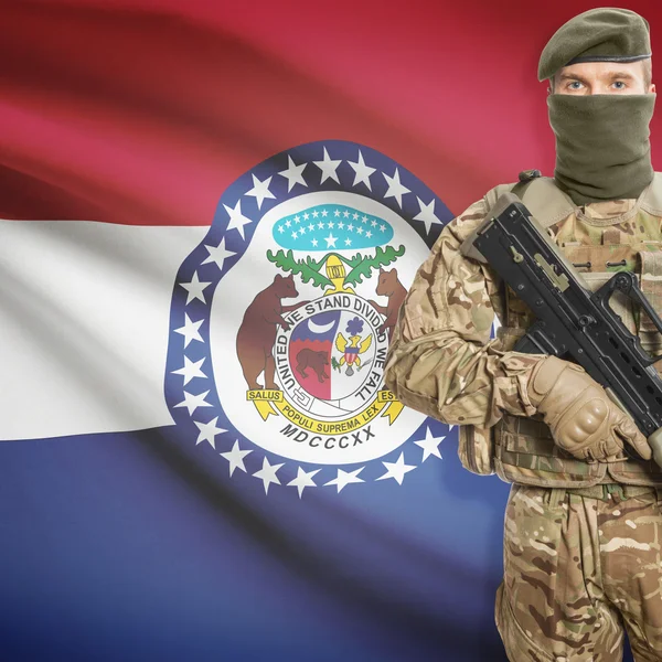 Soldier with machine gun and USA state flag on background - Missouri — Stok Foto