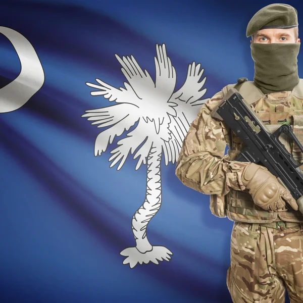 Soldier with machine gun and USA state flag on background - South Carolina — Stok fotoğraf