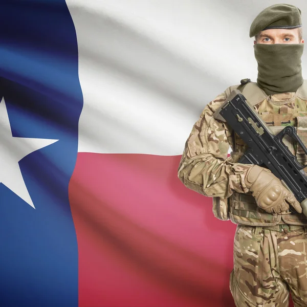 Soldier with machine gun and USA state flag on background - Texas — Stockfoto