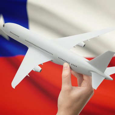 Uçağın içinde el ile arka plan serisi - Şili bayrağı