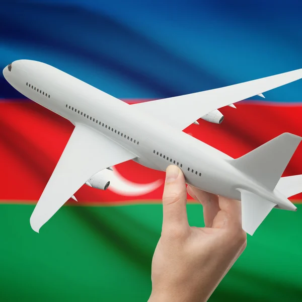 Vliegtuig in hand met vlag op achtergrond serie - Azerbeidzjan — Stockfoto