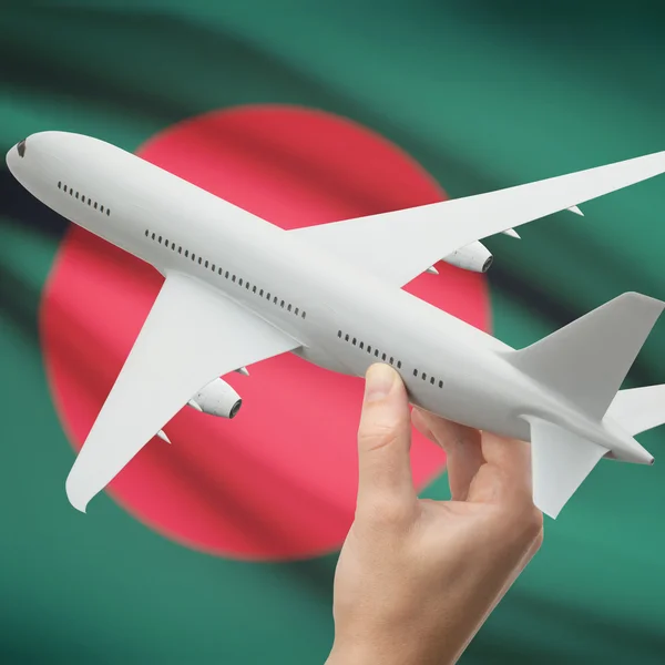 Avião na mão com a bandeira na série de fundo - Bangladesh — Fotografia de Stock