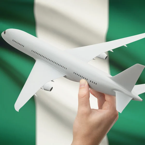 Repülőgép kezében zászló a háttérben sorozat - Nigéria — Stock Fotó